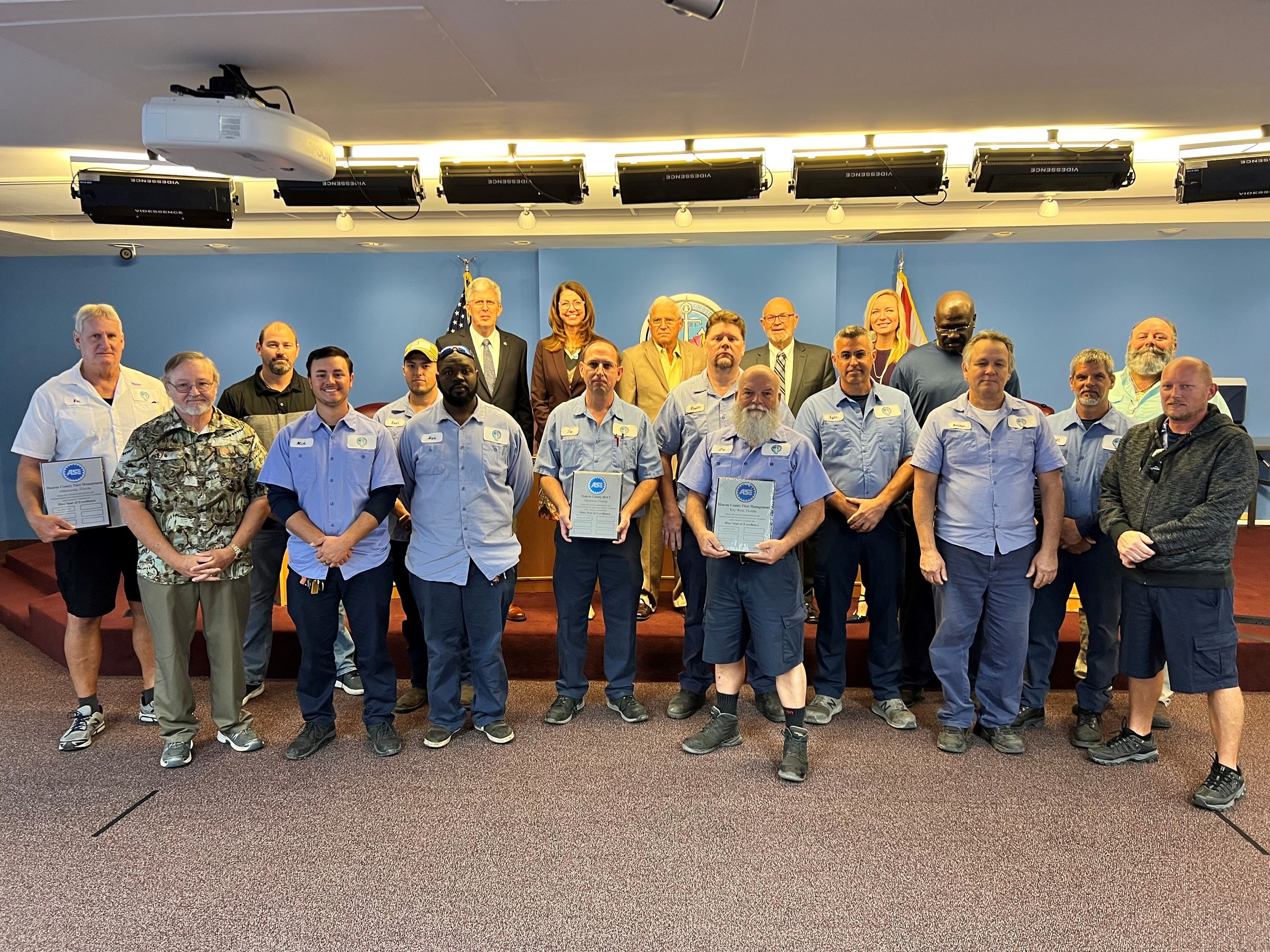 group of fleet employees at the BOCC meeting to accept award